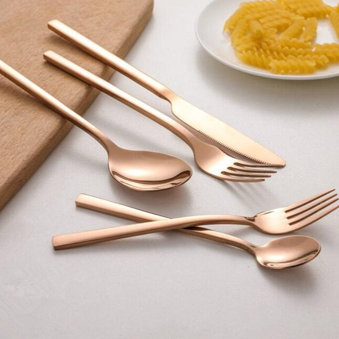 Gold-colored cutlery set in Scandinavian style