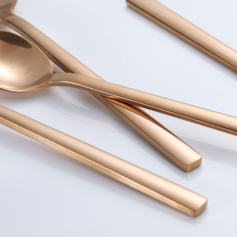 Gold-colored cutlery set in Scandinavian style