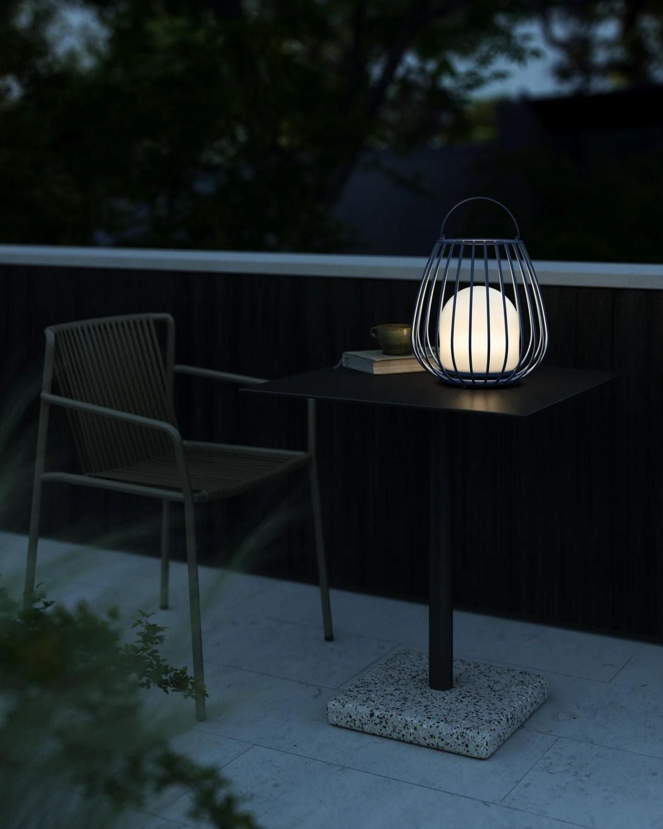 Portable outdoor lamp with cage design and ambient light function