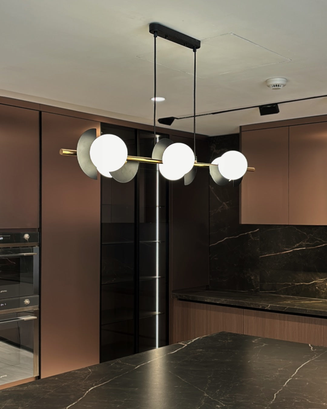 Caelum linear pendant lamp with graphic sphere accents