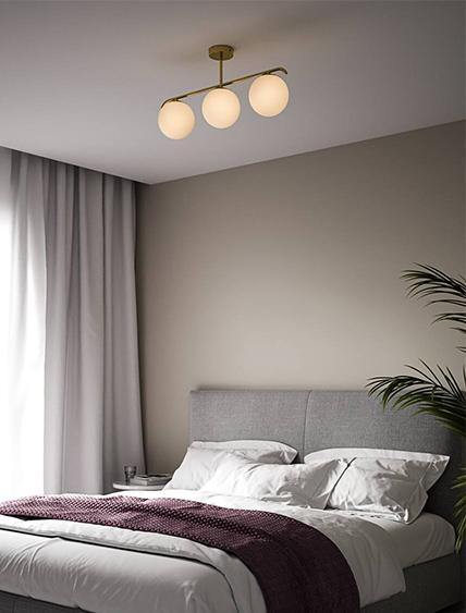 Ceiling lamp with three glass globes and golden frame