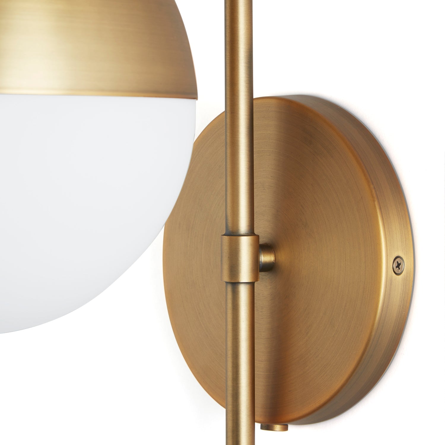 Wall lamp with curved brass frame and opal glass globe