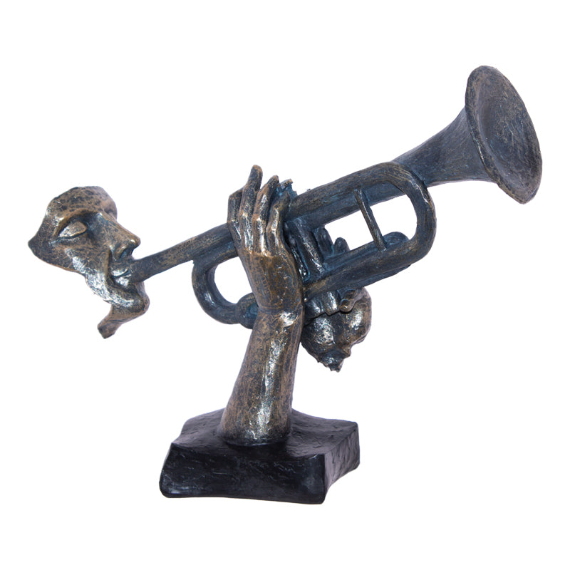 Sculptuur met gezicht en trompet
