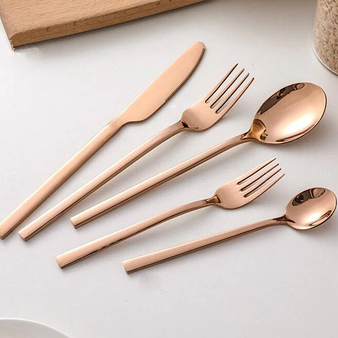 Gold-colored cutlery set in Scandinavian style
