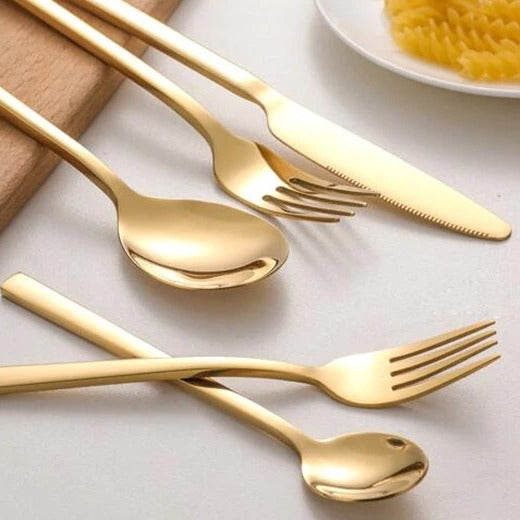 Gold-colored cutlery set in Scandinavian style