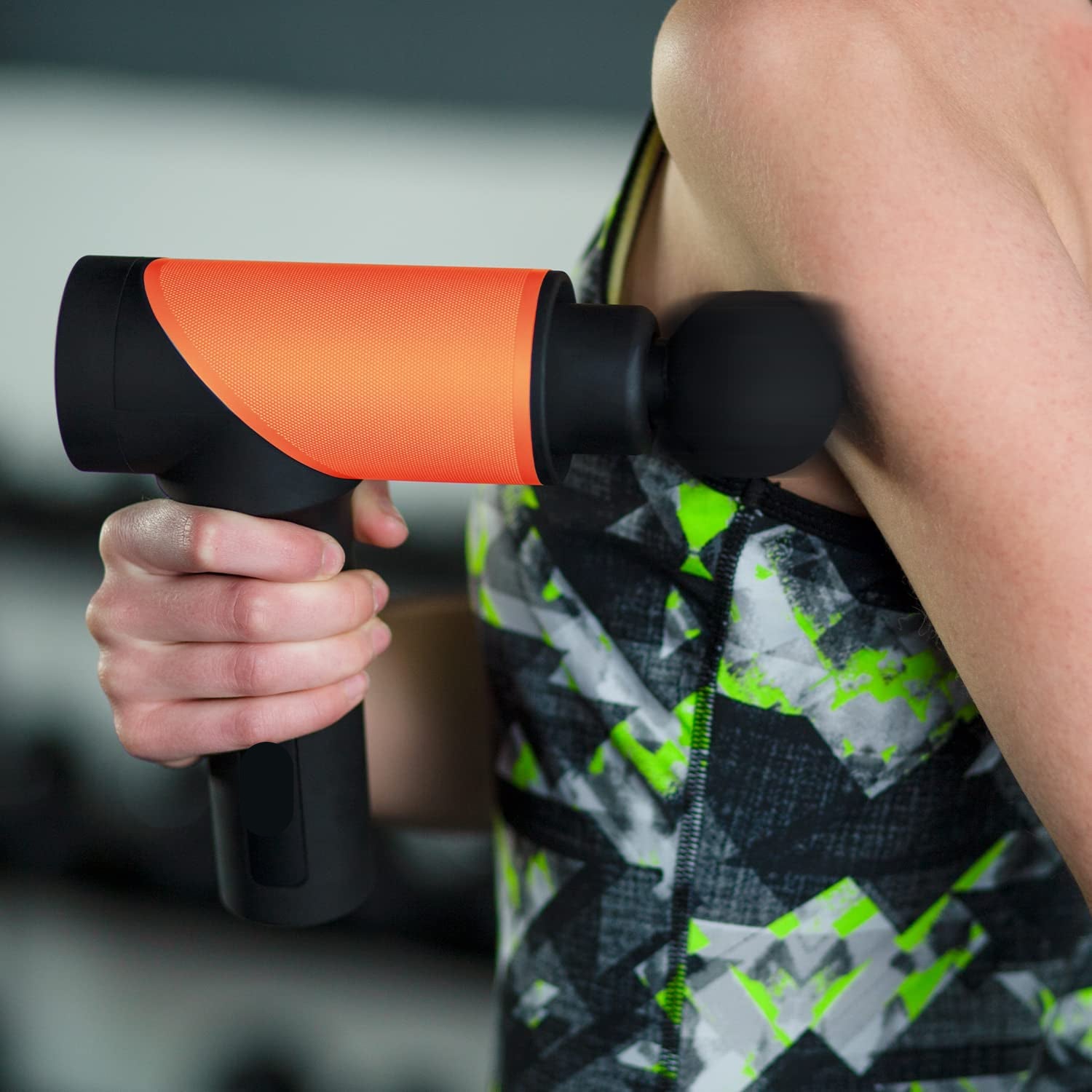 Portable massage device with impact therapy and interchangeable attachments