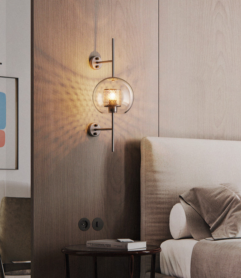 Wall lamp with glass globe and perforated light core
