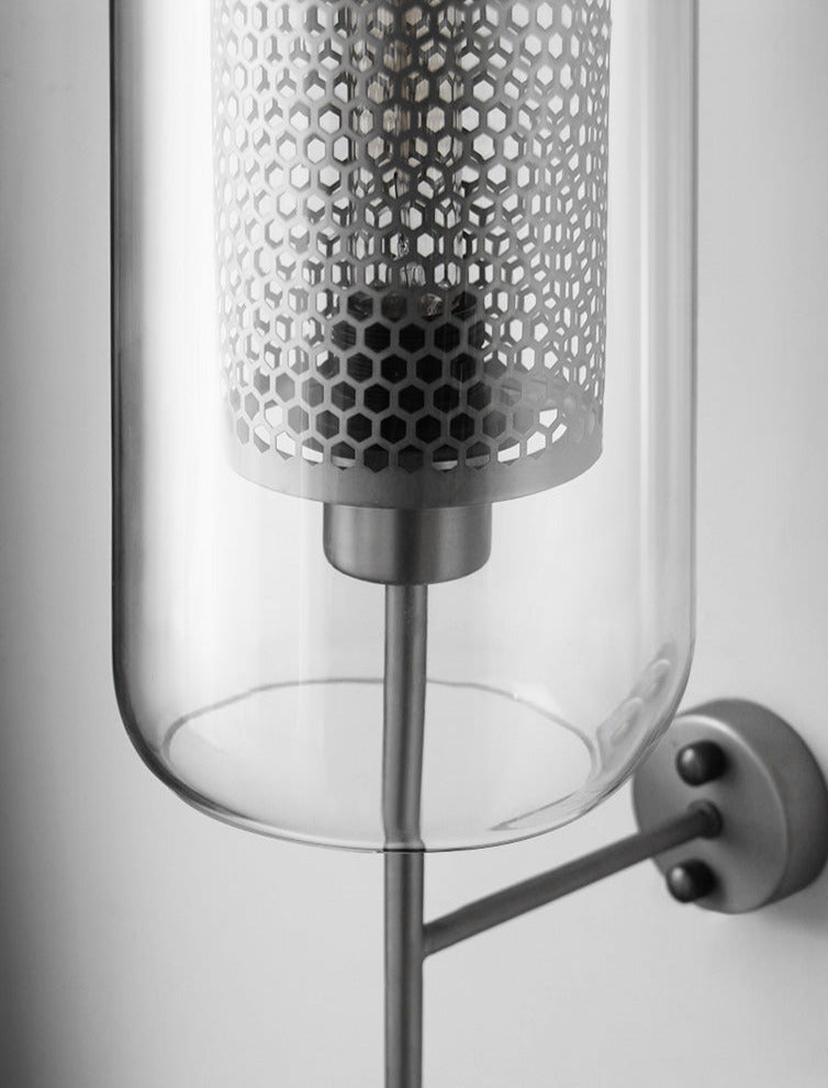 Wall lamp with glass globe and perforated light core