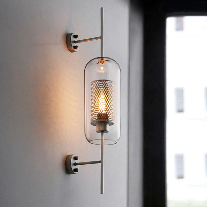 Wall lamp with glass globe and perforated light core