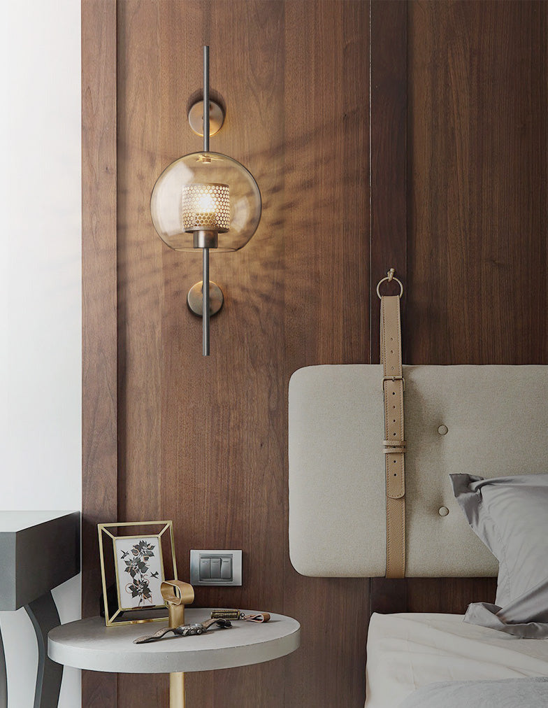Wall lamp with glass globe and perforated light core