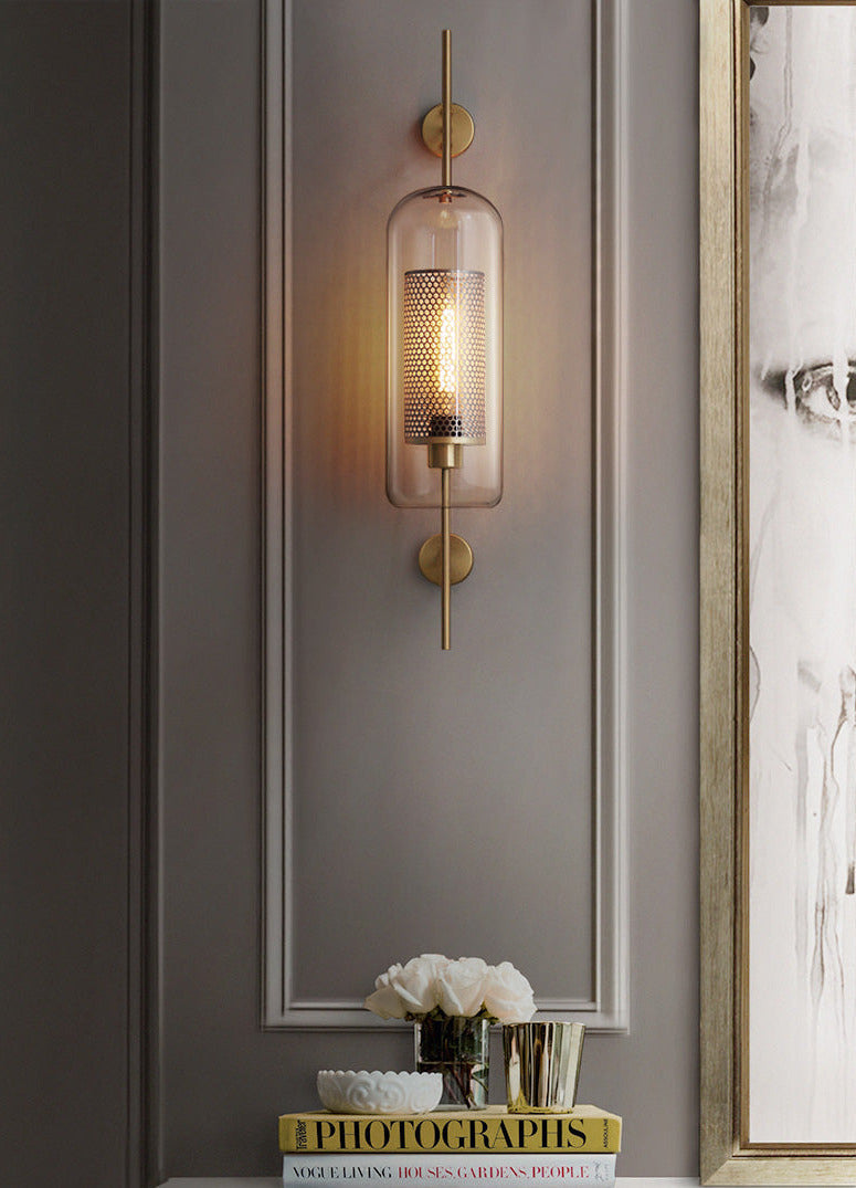 Wall lamp with glass globe and perforated light core