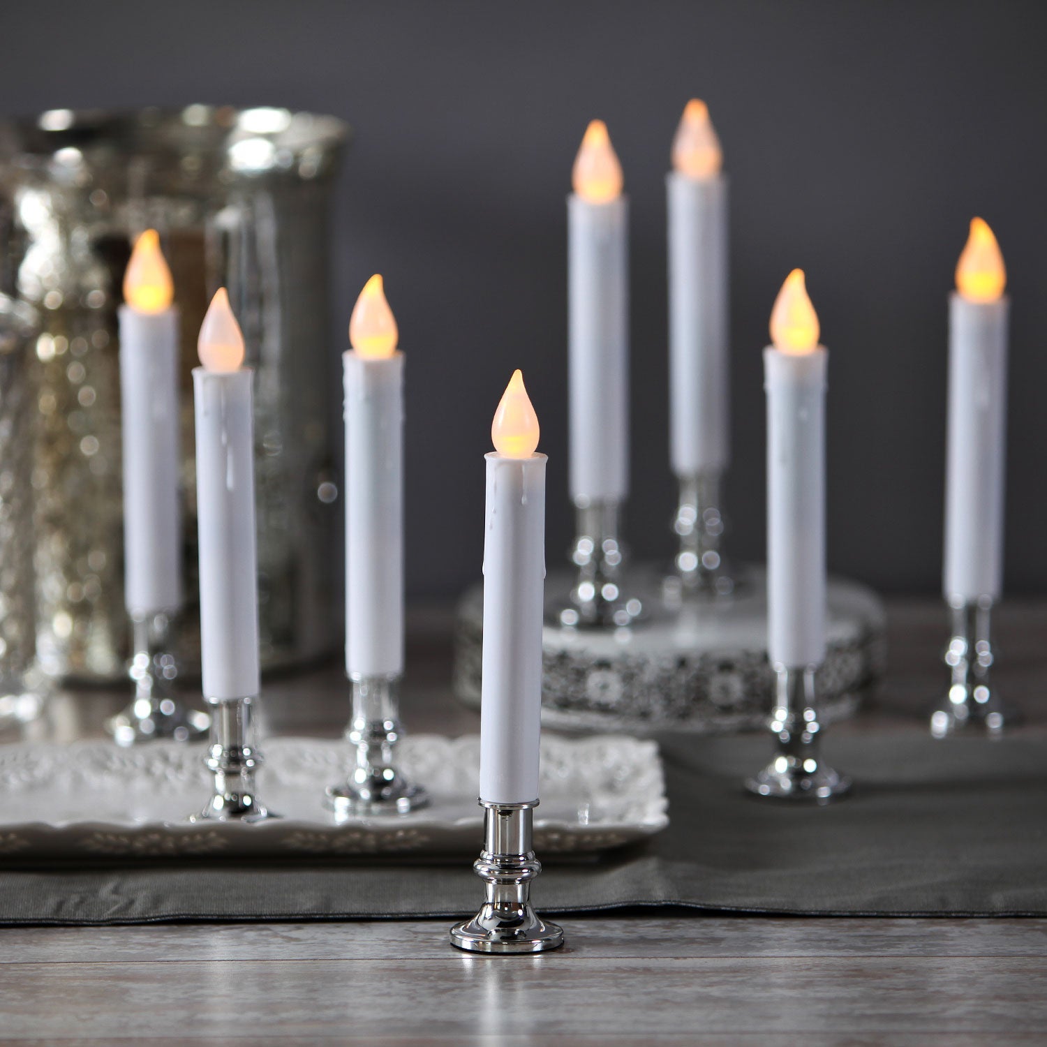 Set of eight LED candles with silver-colored base