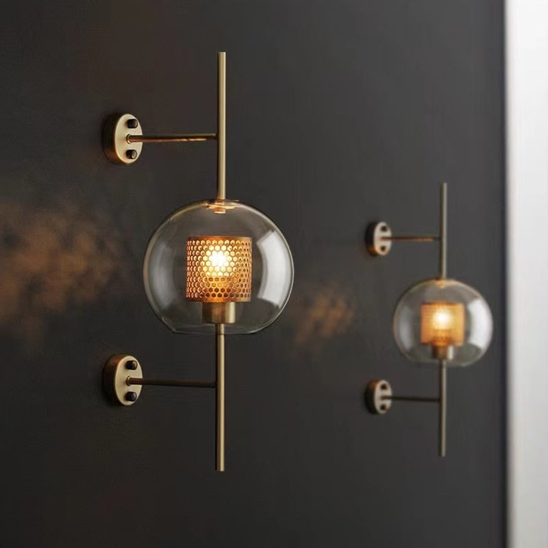 Wall lamp with glass globe and perforated light core