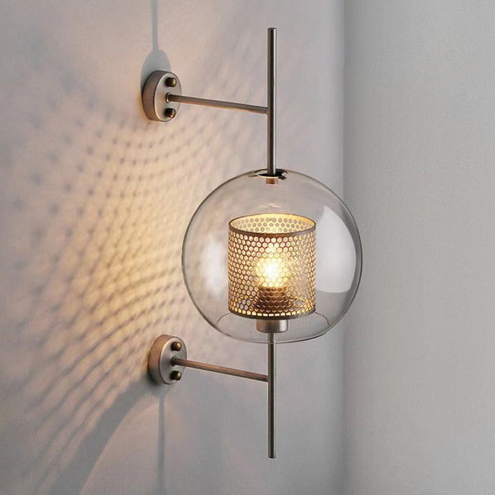 Wall lamp with glass globe and perforated light core