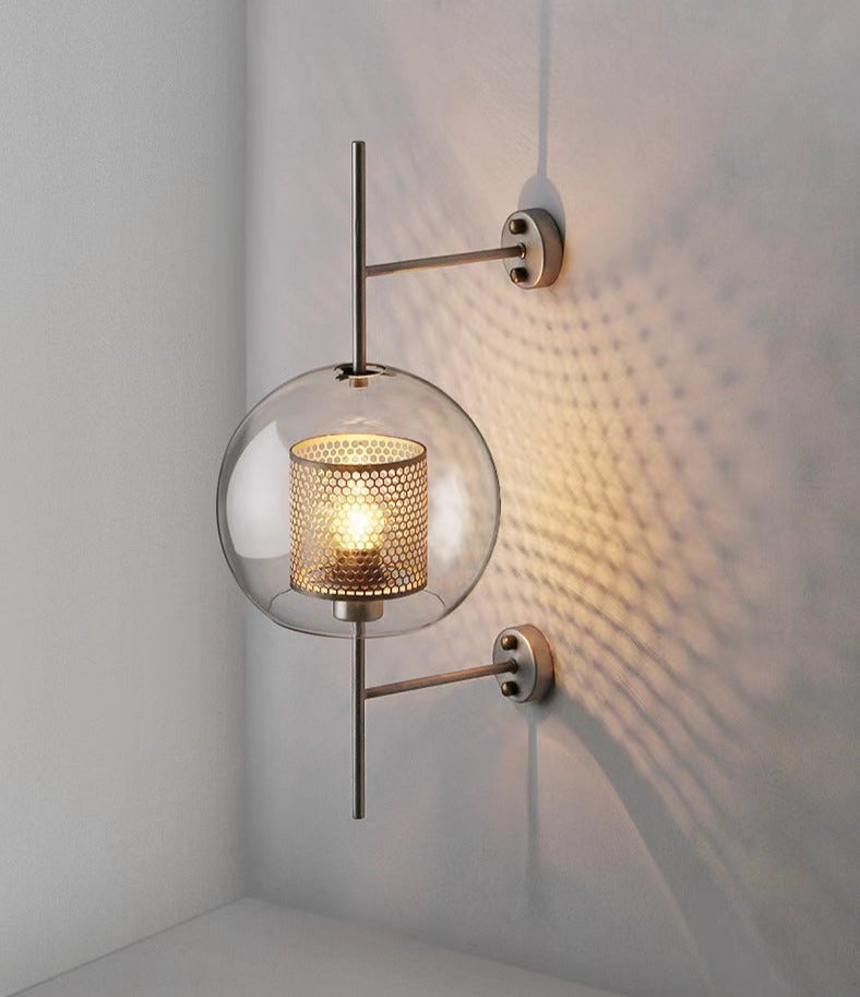 Wall lamp with glass globe and perforated light core