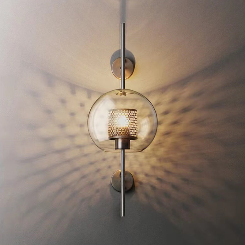 Wall lamp with glass globe and perforated light core