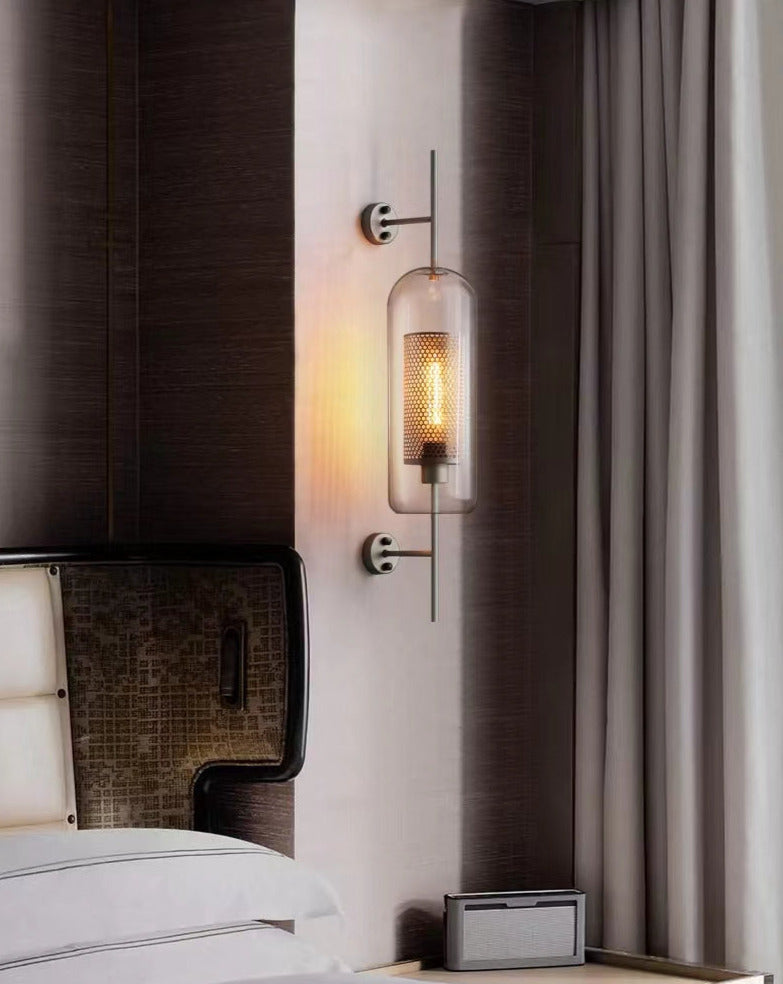 Wall lamp with glass globe and perforated light core
