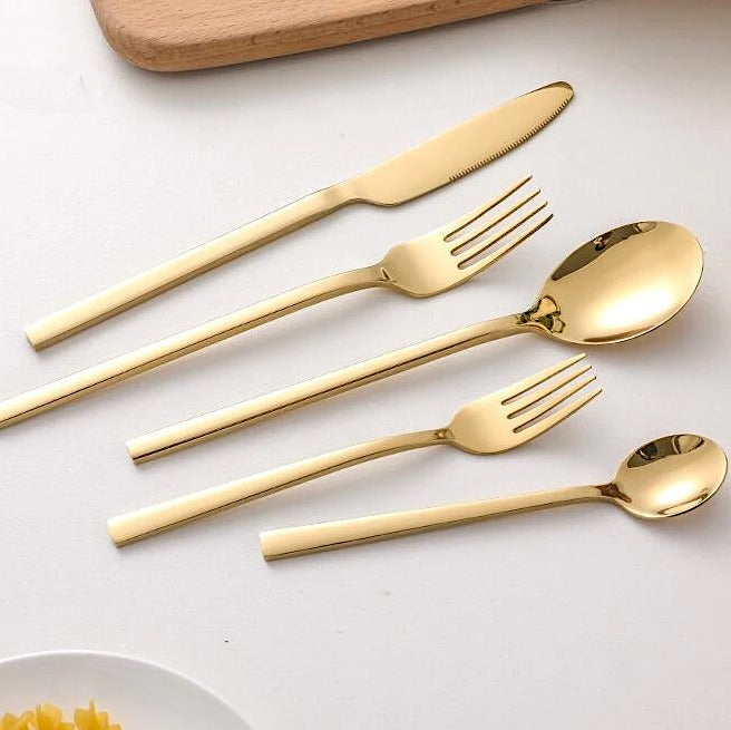 Gold-colored cutlery set in Scandinavian style
