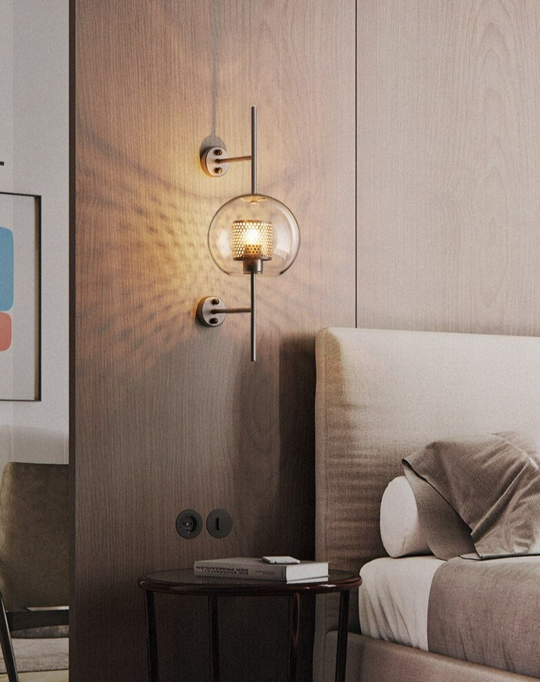 Wall lamp with glass globe and perforated light core